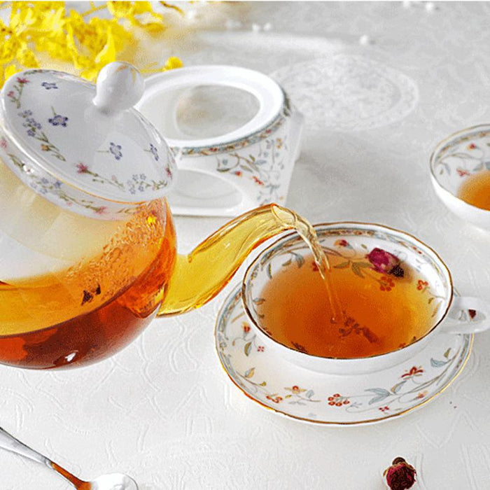 Gold-Rimmed Ceramic Tea Cup And Saucer Set